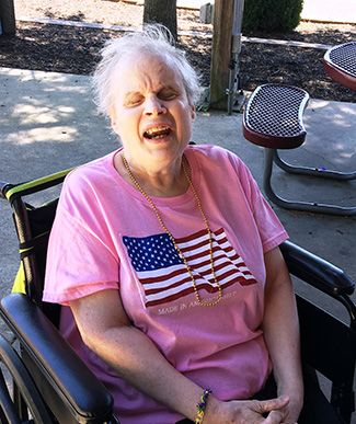 An AMIB member in a wheelchair wearing an American flag T-Shirt.
